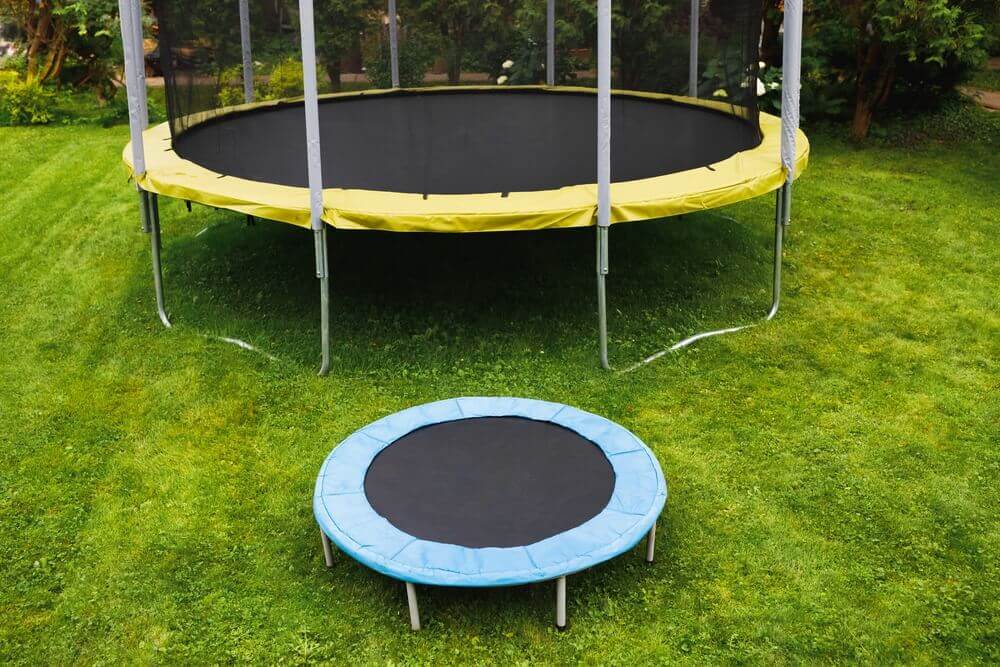 two trampolines on grass