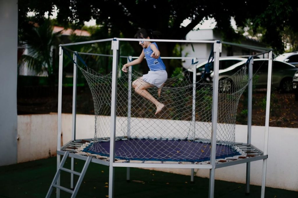Girl Jumping On A Trampoline 1